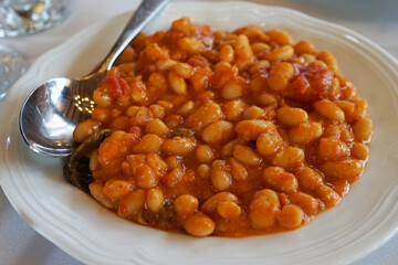Close up 'Fagioli Alluccelletto' Tuscan baked beans braised in Tomato and Sage sauce