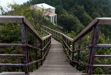 Fototapeta na wymiar Wooden stairway on the top of the mountain