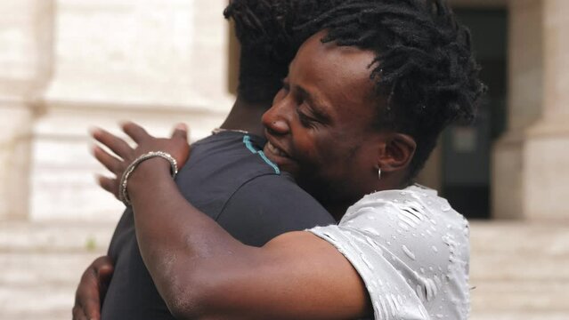 Affectionate Embrace Between Two Black Friends
