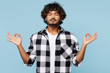 Young Indian man wears shirt white t-shirt casual clothes hold spreading hands in yoga om aum...