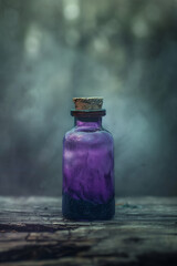 An old small bottle - vial with a violet glass stopper with poison or medicine stands on a wooden...