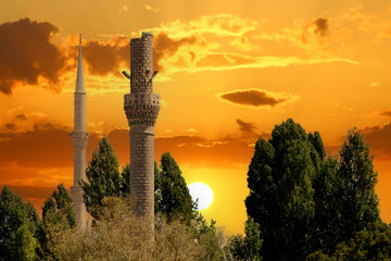 An old destroyed minaret and a solid minaret