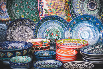 Multi-colored ceramic products with oriental ornaments at the Siab Bazaar in the ancient city of Samarkand in Uzbekistan, Siyob bozor