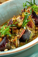 Baked figs with nuts in a plate