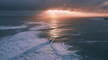 Moody Aerial Landscape Depict a dramatic aerial view of a vast coastline during a stormy sunset