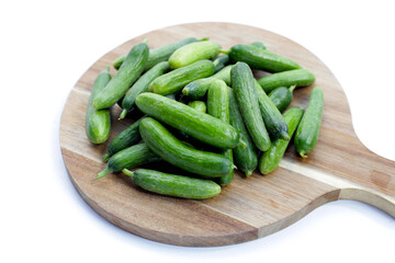 Mini cucumbers on white background.