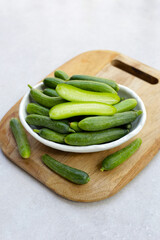 Mini cucumbers on white background.