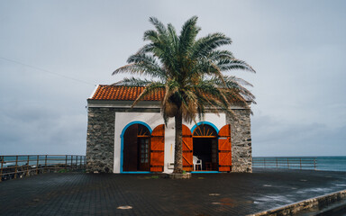 Porto do Seixal, a natural black sand beach on Madeira island offers breathtaking landscape — the cliffs and mountains of the north coast - and swimming in the crystal-clear water of the volcanic 