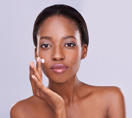 Portrait, cream and black woman for beauty and dermatology, cosmetic product and shine on white...