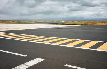 Photo of the runway on Baltra Island, selective focus, Galapagos Islands, Ecuador.