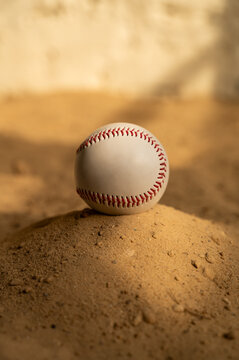 Baseball ball on the sand. Close up