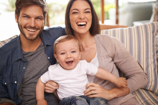 Laughing, happy family or portrait of baby on sofa in home for support, security or bonding in living room. Parents, boy or toddler with mom or father for love or care for child development or growth
