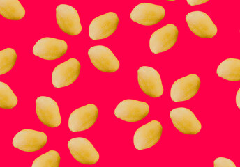 Seamless pattern of whole, raw mangoes scattered on a vibrant red background, ideal for culinary themes or as a tropical fruit background with copy space