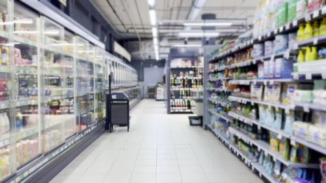 supermarket shelves, blurred background, empty store