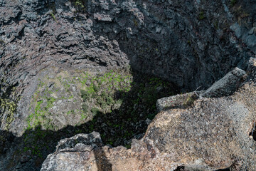 Devils Throat. Hawaiʻi Volcanoes National Park. Chain of Craters Rd. pit craters are depressions that form primarily as the earth fractures when a volcano shifts or expands. 