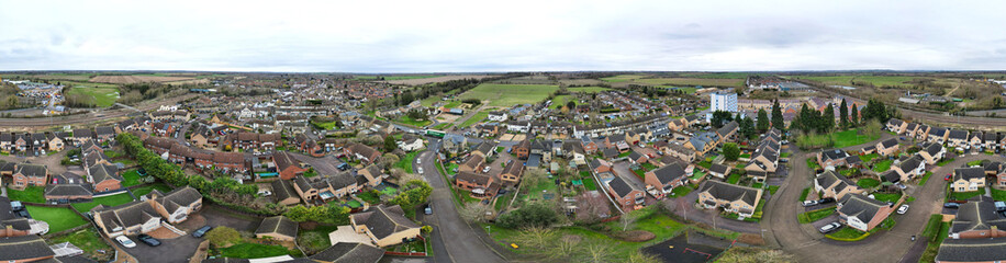 Obraz premium High Angle Ultra Wide Panoramic View of Arseley Town of England UK. The Footage Was Captured During Cloudy and Rainy Day of Feb 28th, 2024