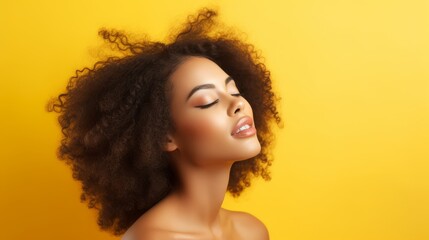 An African American Fashion Model portrait with afro hair style and closed eyes on a colorful background. The brunette young woman is displaying some creative yellow makeup, lips, and eyeshadows. - obrazy, fototapety, plakaty