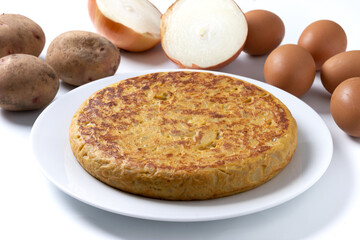 Traditional spanish omelette and ingredients isolated on white background