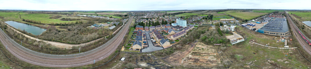 Fototapeta na wymiar High Angle Ultra Wide Panoramic View of Arseley Town of England UK. The Footage Was Captured During Cloudy and Rainy Day of Feb 28th, 2024