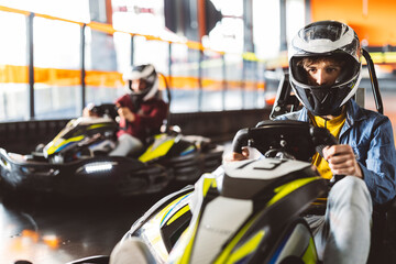 kart racing championship overtaking rivals on circuit road teenager holding the steering wheel