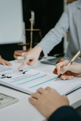 Legal counsel presents to the client a signed contract with legal law. justice and lawyer concept in office.