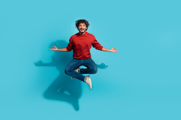 Full body size photo of meditation young latin guy keep work life balance jumping yoga pose lotus isolated on aquamarine color background
