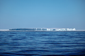 Tabular iceberg and sea ice in antarctica