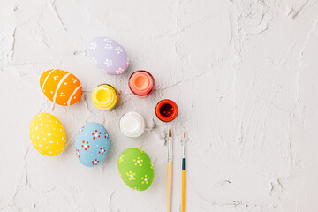 Easter Day Concept. colored multi-colored and paints brush painting easter eggs, colorful paints...
