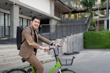 The businessman eco friendly transportation, cycling through the city avenues to go to work. sustainable lifestyle concept