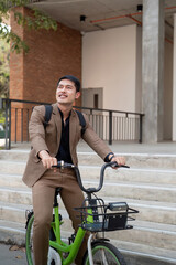 The businessman eco friendly transportation, cycling through the city avenues to go to work. sustainable lifestyle concept