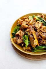 Stir-fried rice noodles with soy sauce and pork