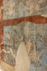Fresco on the wall of Suburban Baths in ruins of an ancient city destroyed by eruption of volcano Vesuvius, Pompeii, Naples, Italy