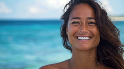 Fototapeta premium Smiling woman enjoying a sunny day by the ocean.