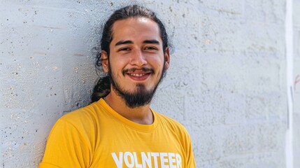 Fototapeta premium Smiling man with beard wearing yellow t-shirt with 