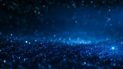 Video animation background of  numerous small, glowing blue lights scattered across a dark background, creating an effect reminiscent of stars in the night sky or particles in deep space
