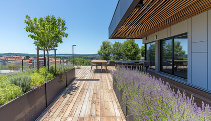 An outdoor terrace with seating arrangements and plants is connected to the open space office - offering fresh air and sunlight