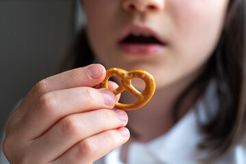 Girl Eating German Pretzel: Close-Up