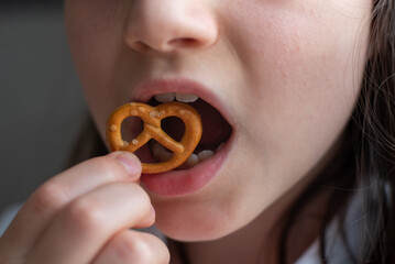 Girl Eating German Pretzel: Close-Up