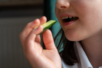 Child Eating Cucumber: Close-Up of Mouth