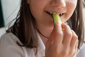 Child Eating Cucumber: Close-Up of Mouth