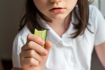 Child Eating Cucumber: Close-Up of Mouth