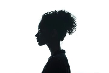 A silhouette of a woman with curly hair. Ideal for diverse projects