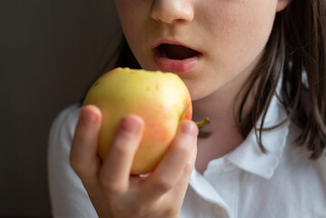 Child Eating Apple: Close-Up of Mouth