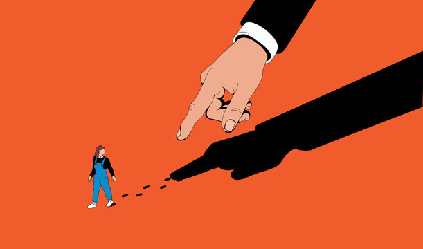 Finger and shadow pointing to woman&rsquo;s carbon footprint