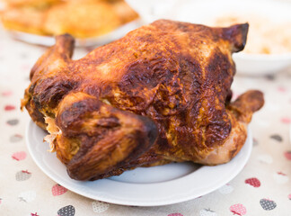 Whole roasted chicken on a plate