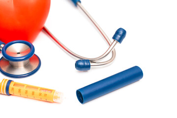 Stethoscope with insulin on white background