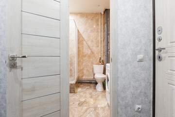 modern bathroom room with toilet and washing machine