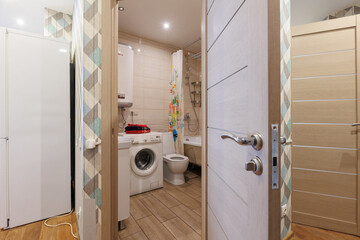 modern bathroom room with toilet and washing machine
