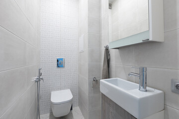modern bathroom room with toilet and washing machine
