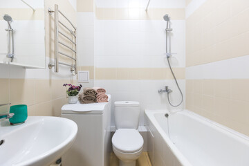 modern bathroom room with toilet and washing machine